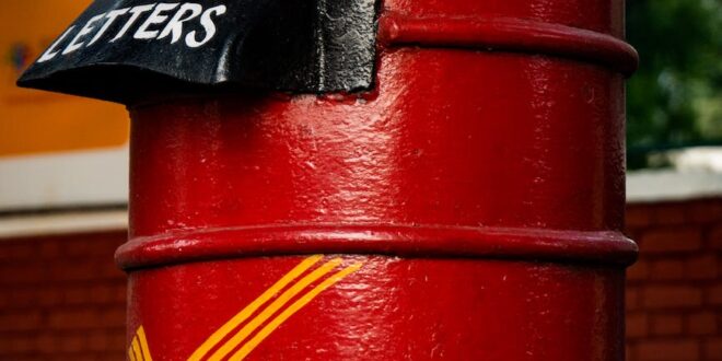 close up photo of a red postbox