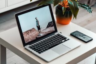 macbook on white table