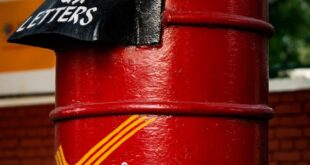 close up photo of a red postbox